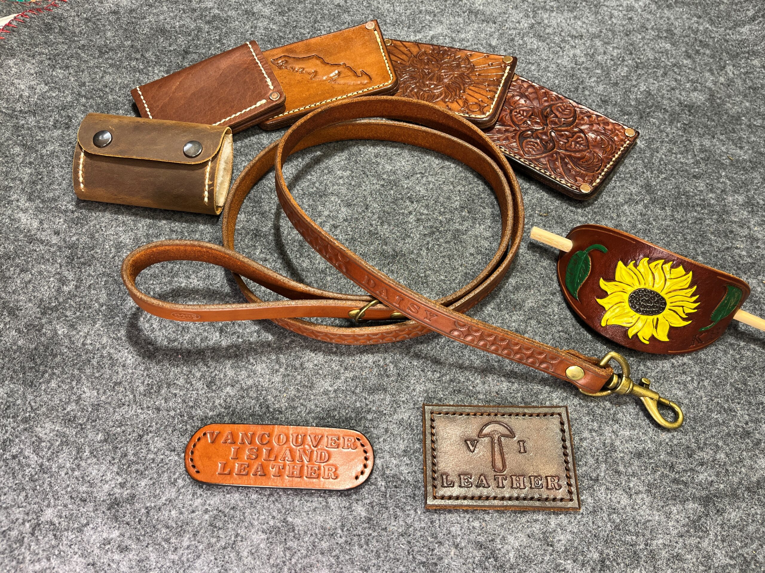 https://vancouverislandleathercraft.com/wp-content/uploads/2023/03/wallets-dogleash-hairclip-logos-scaled.jpg