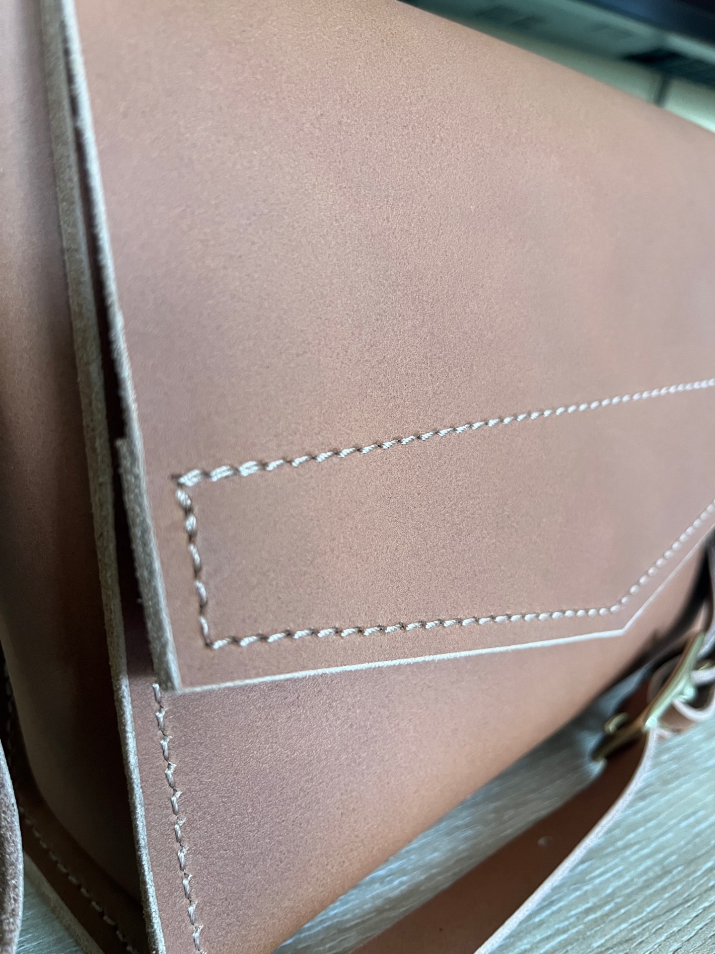 closeup of front cross body leather bag